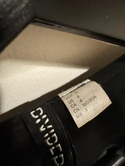 Sale H&M Divided Black blazer with front zipper.