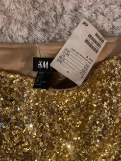 Best H&M Kultaiset shortsit S